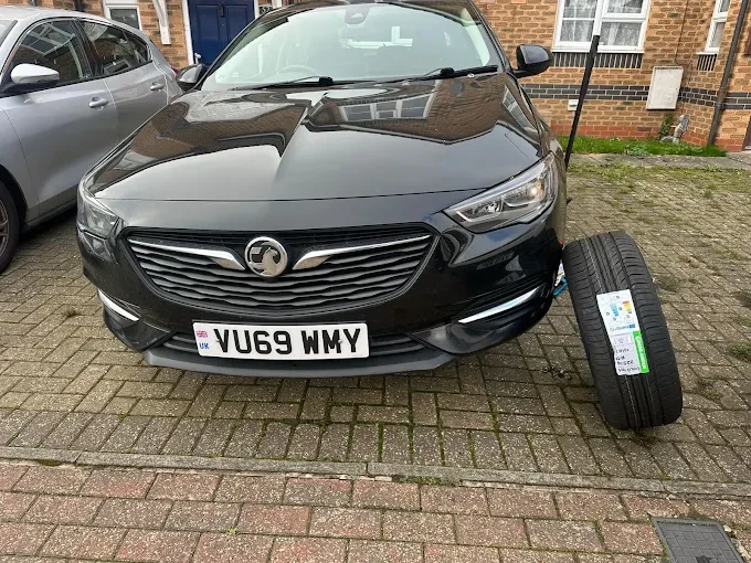 Professional mobile tyre technician repairing a tyre at home or work.
