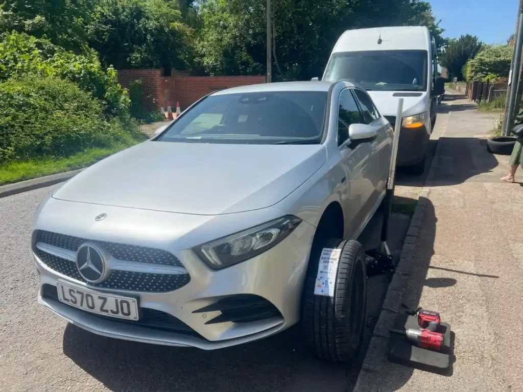 Motor Tyre technician performing a rapid 24/7 mobile tyre change Luton wide and across the Beds, Herts, and Bucks region for a roadside rescue.